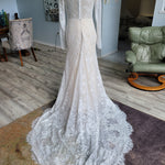 Long sleeve lace mermaid bridal gown with boat neck and button back, handcrafted bespoke wedding dress