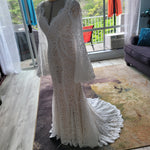 Boho mermaid lace wedding dress with long bell sleeves and scalloped V-neck, bespoke handcrafted bridal gown