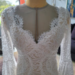Boho mermaid lace wedding dress with scalloped V-neck and long bell sleeves, handcrafted bridal gown