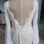 Scalloped lace open back boho mermaid wedding dress with long bell sleeves and buttons, handcrafted bridal gown