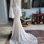 Bespoke boho mermaid lace wedding dress with long bell sleeves and scalloped V-back, handcrafted bridal gown