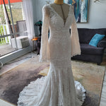 Bespoke boho mermaid crochet lace wedding dress with deep V-neck and bell sleeves, handcrafted bridal gown