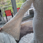 Boho mermaid crochet lace wedding dress with flared bell sleeves and V-neckline, bespoke handcrafted bridal gown