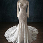 Bespoke beaded boho lace mermaid wedding dress with long sleeves and plunging V-neck, handcrafted bridal gown