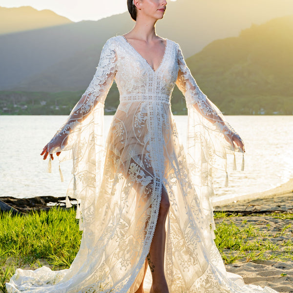 Bespoke boho mermaid A-line lace wedding dress with bell sleeves and beaded V-neck, handcrafted bridal gown