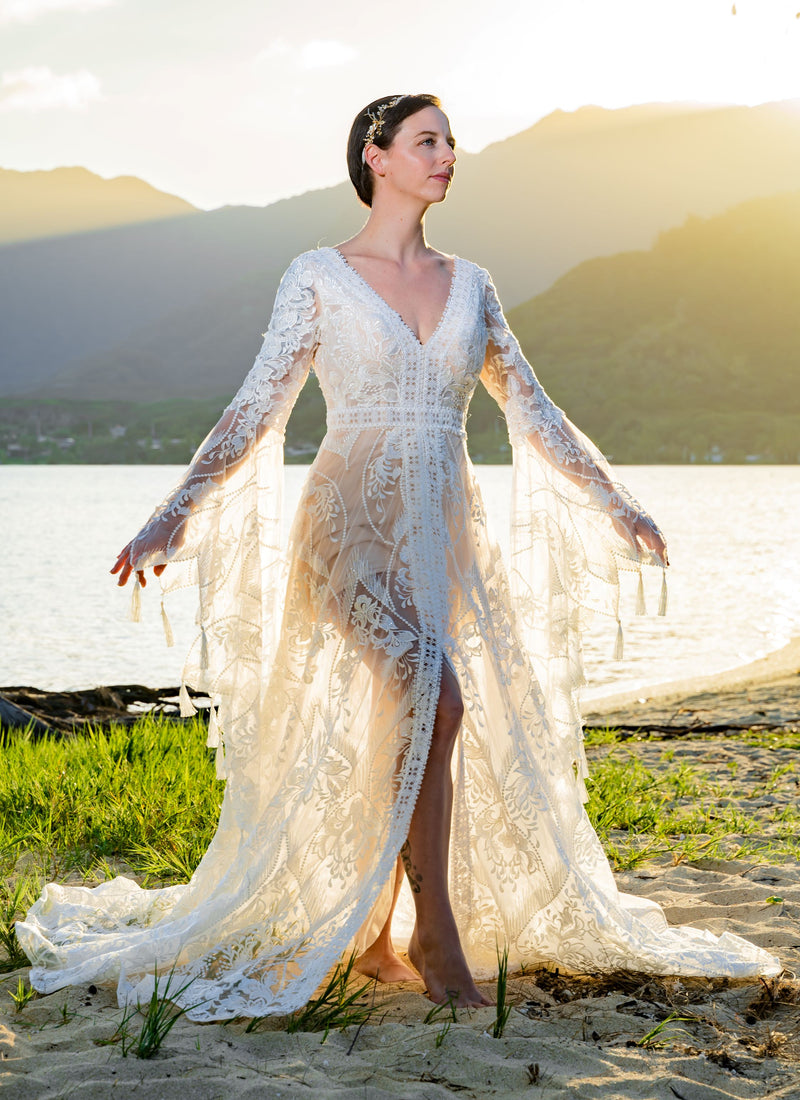 Bespoke boho mermaid A-line lace wedding dress with bell sleeves and beaded V-neck, handcrafted bridal gown